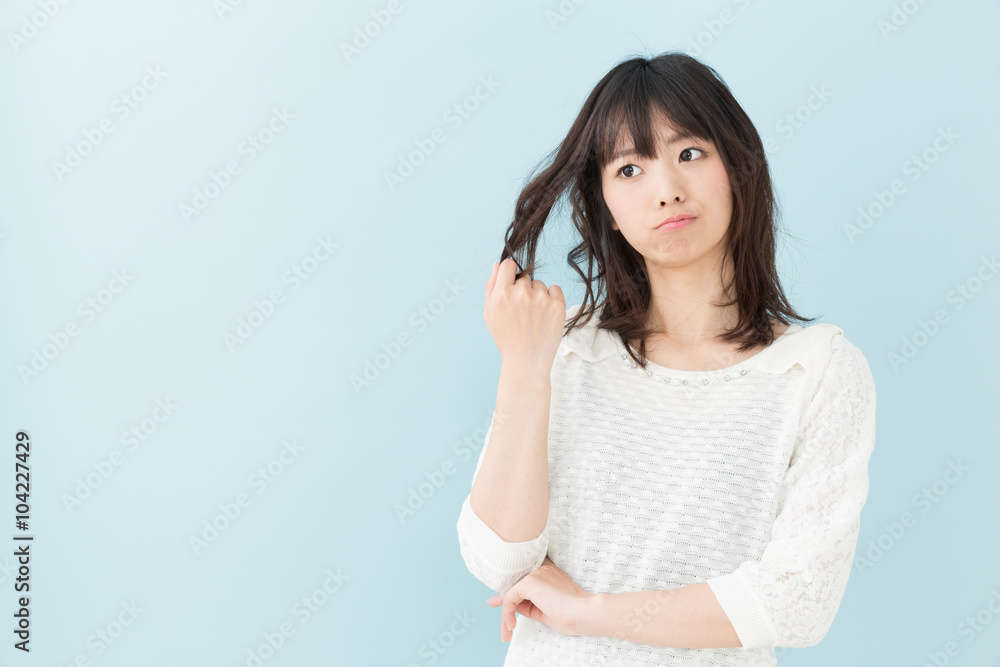 attractive asian woman on blue background