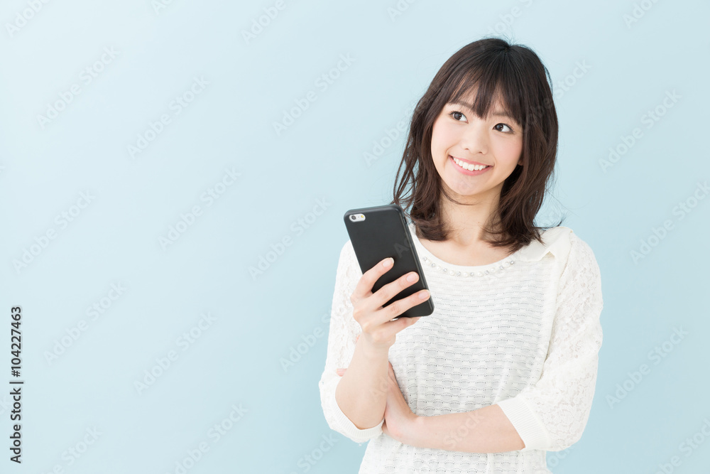 attractive asian woman on blue background