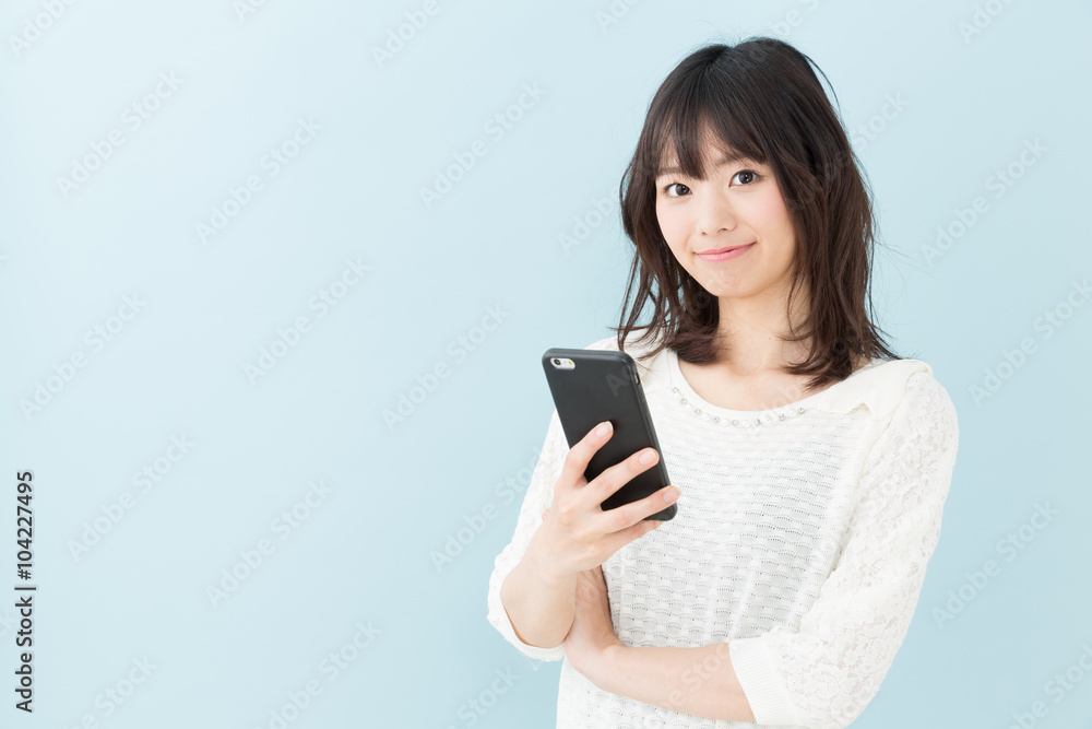 attractive asian woman on blue background