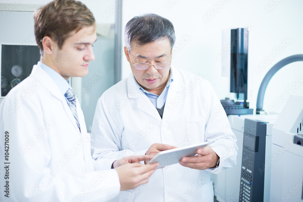 people analysis chemical experimental data with tablet