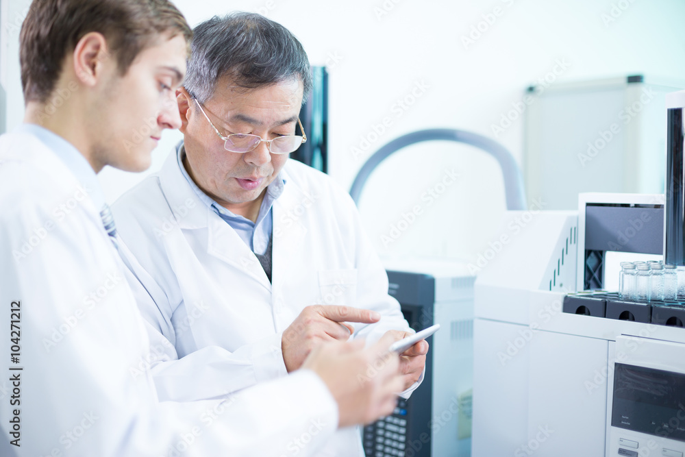 people analysis chemical experimental data with tablet