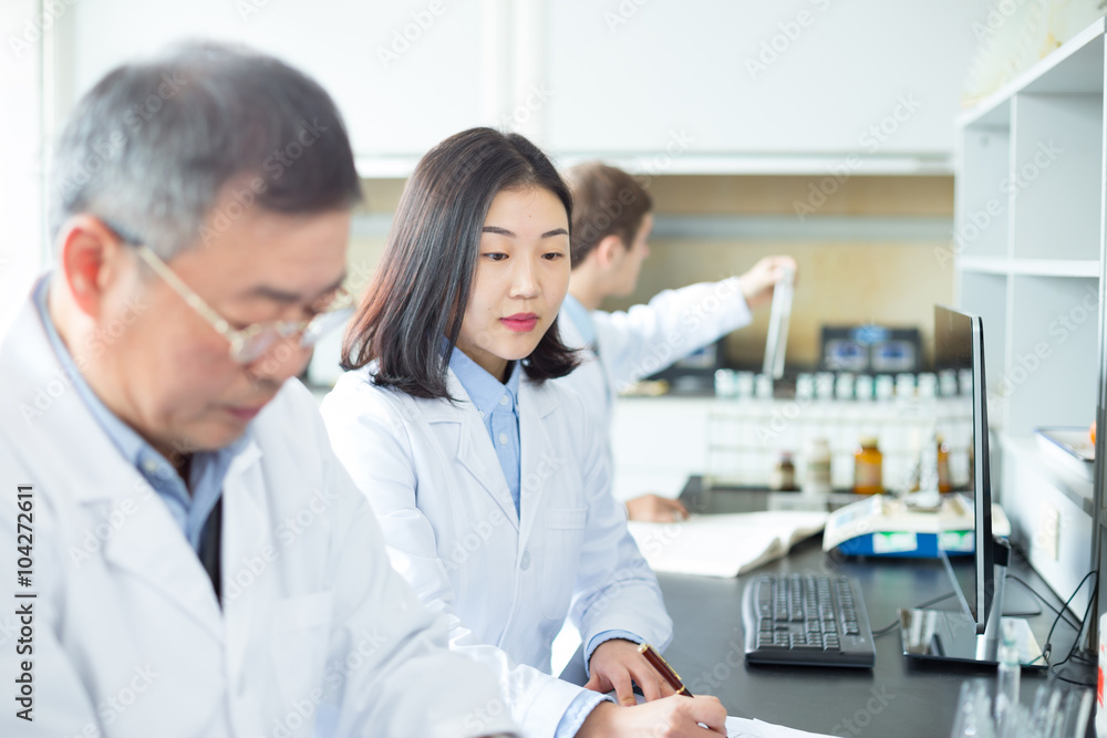 people doing chemical experiment in modern lab