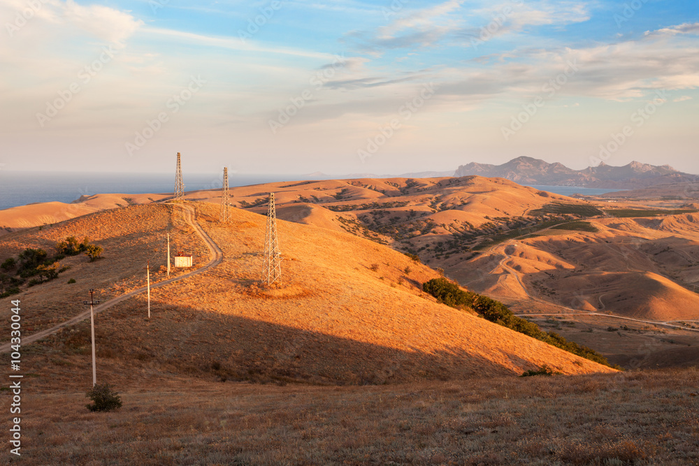 Beautiful view at the mountain valley with cloudy blue sky at sunset in summer. Nature landscape