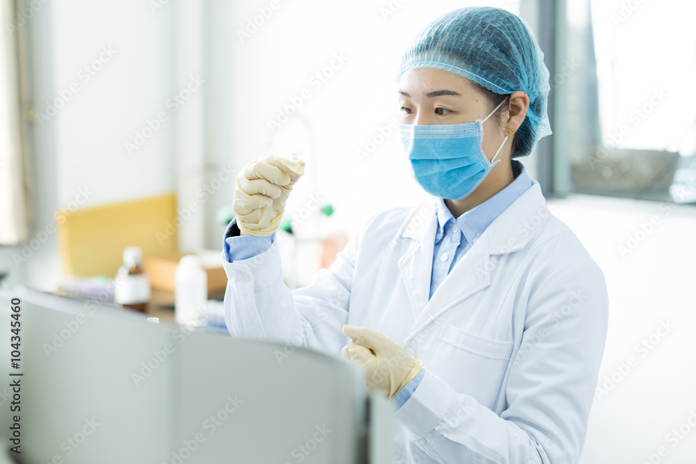 beautiful young girl does medical experiment in lab