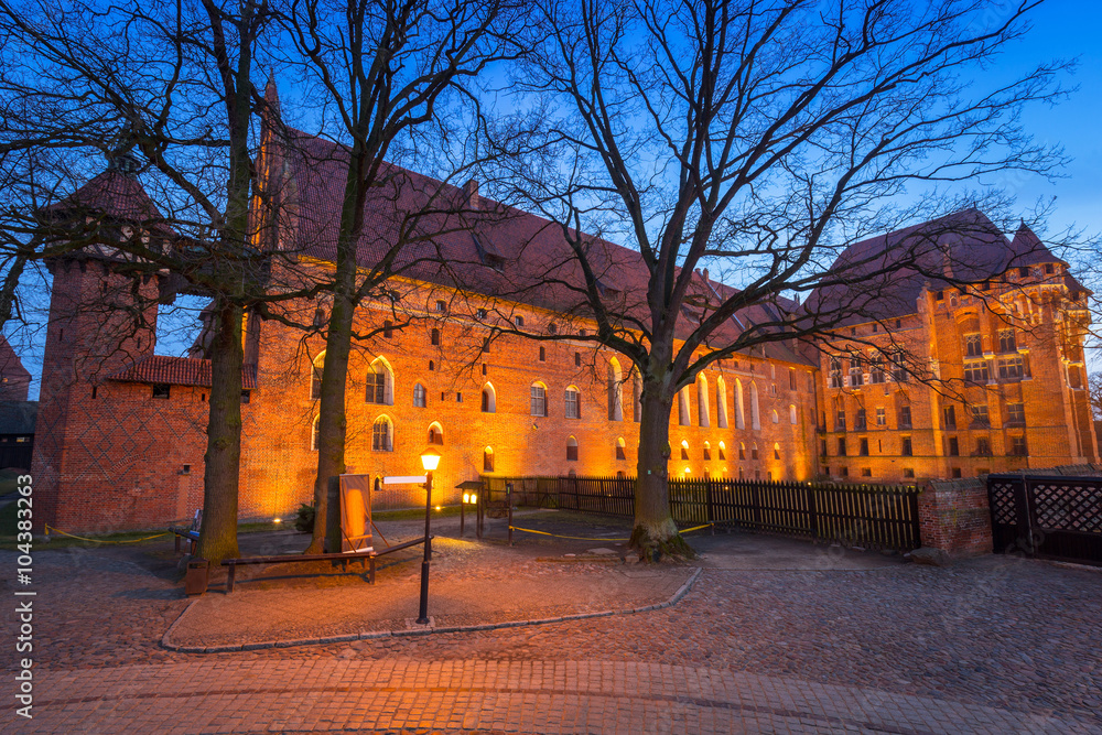 The Castle of the Teutonic Order in Malbork at dusk, Poland