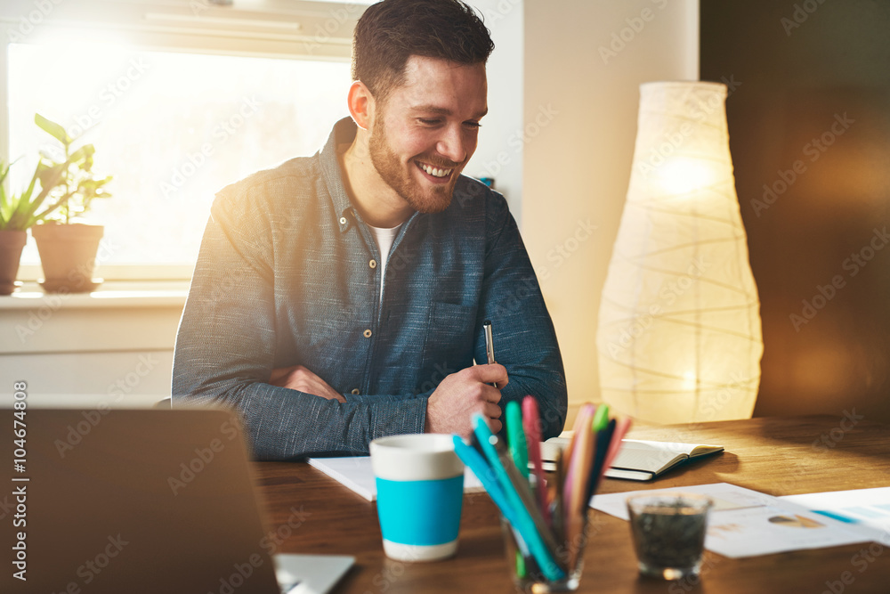 Small business entrepreneur at work in his office