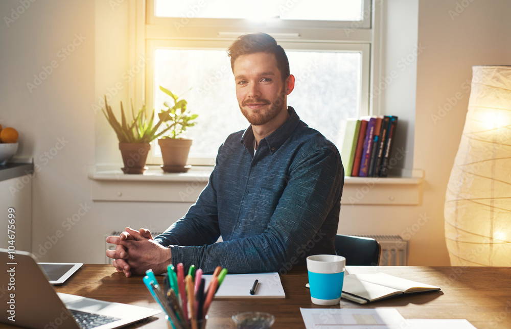 Successful businessman sitting thinking