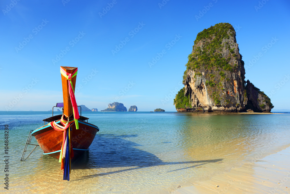 Long tail boat on tropical beach in Thailand