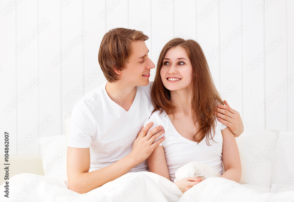 Happy couple in bed