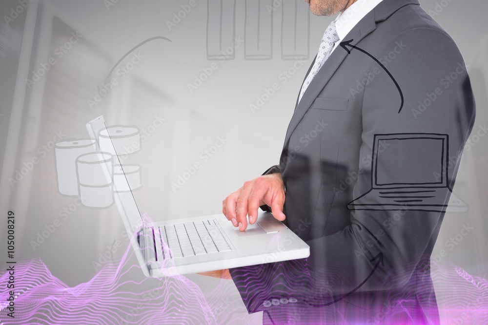 Composite image of businessman holding laptop