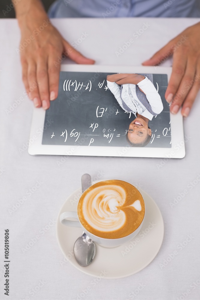 Composite image of close-up of digital tablet and coffee