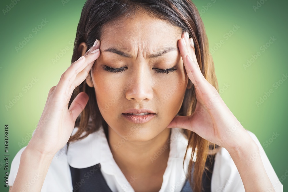 Nervous businesswoman holding her head