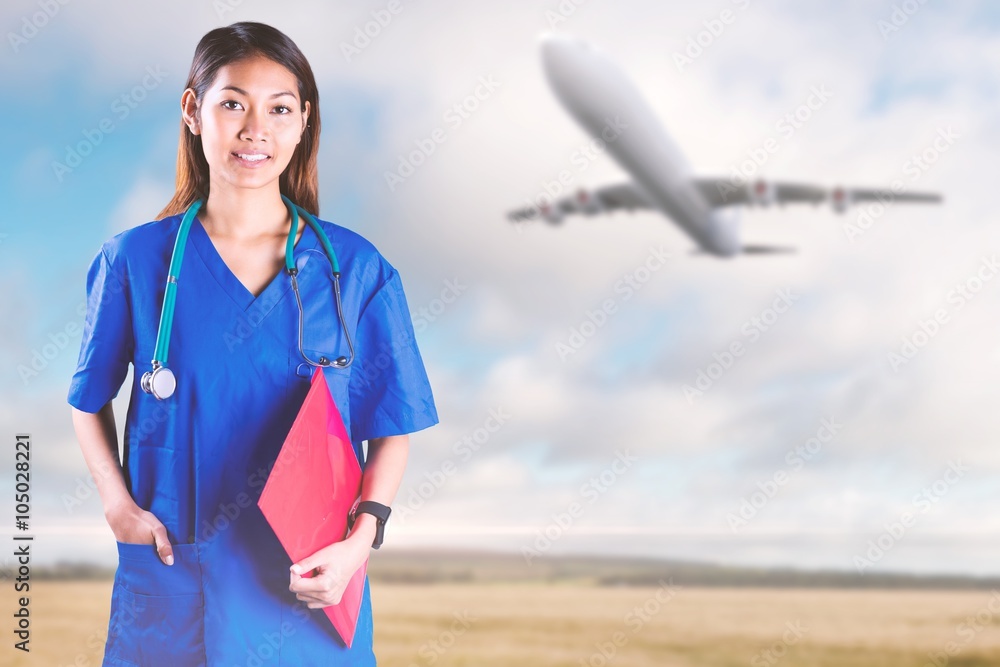 Composite image of asian nurse with stethoscope 