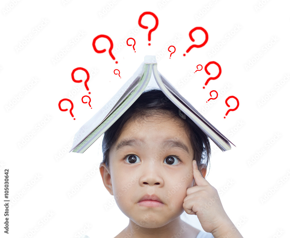 Portrait of little Asian child thinking and put a book on top