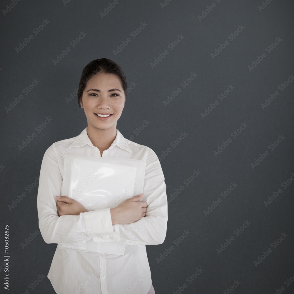 Composite image of casual businesswoman smiling at camera