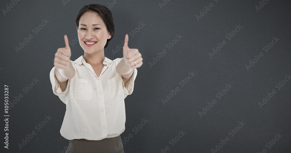 Composite image of business colleagues gesturing thumbs up