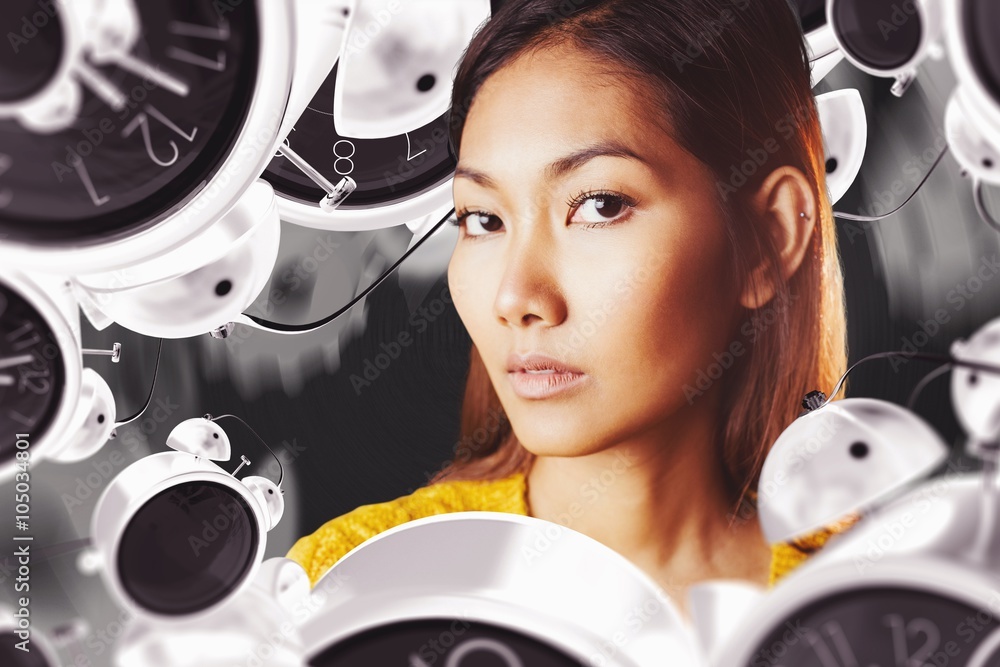 Composite image of serious asian woman with hands on shoulders