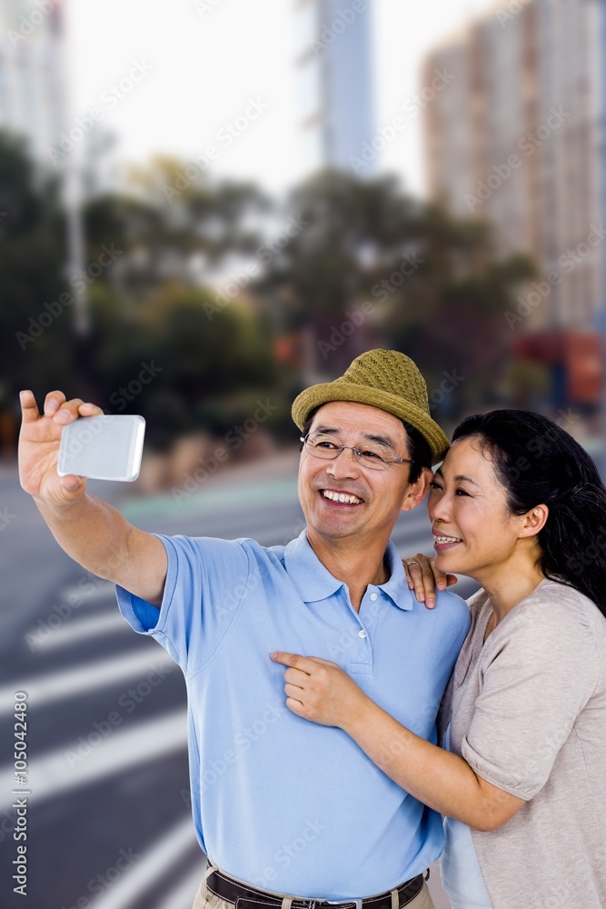 Composite image of man and woman taking a picture