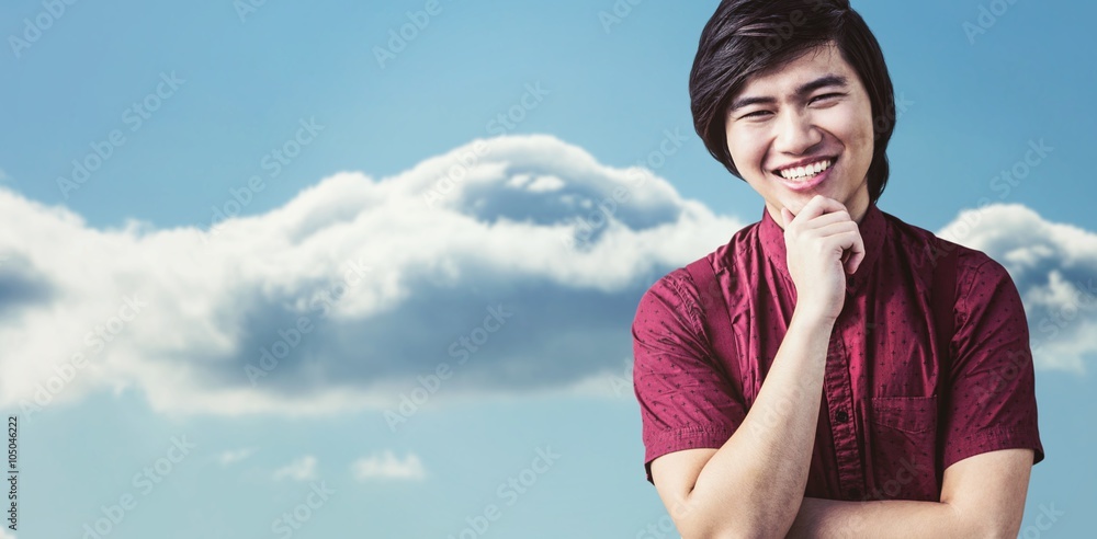 Composite image of smiling hipster holding his chin