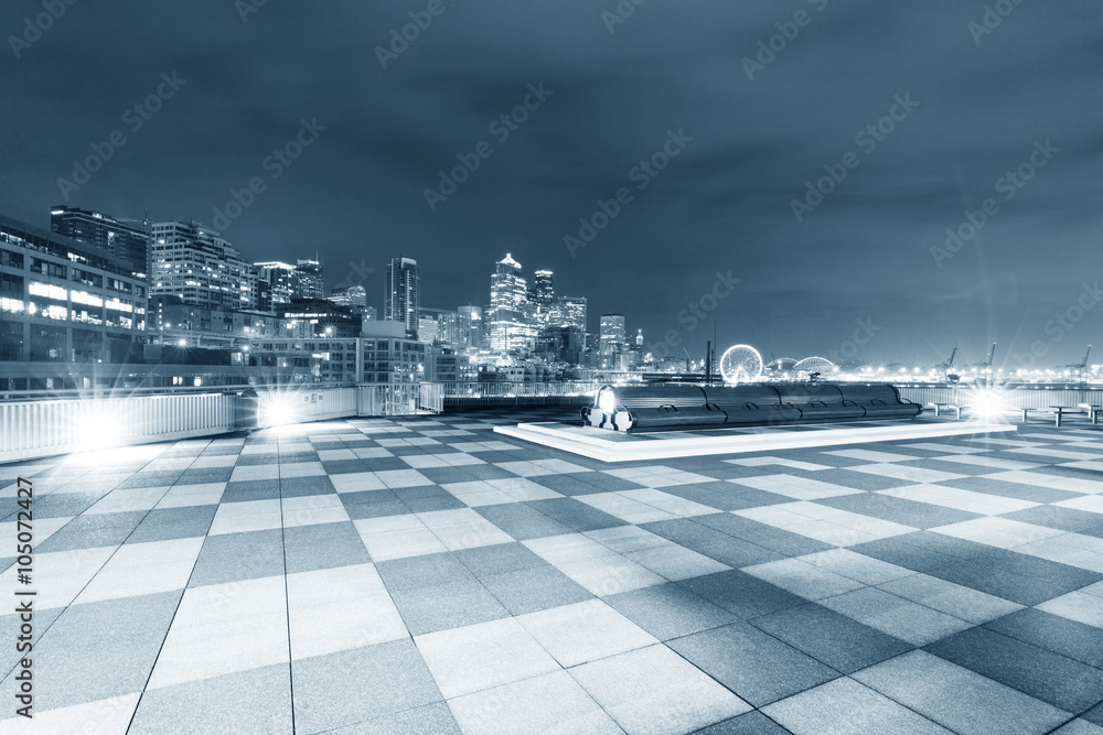 marble floor with cityscape of seattle at night