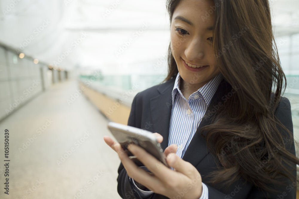 Women using the smartphone to break time