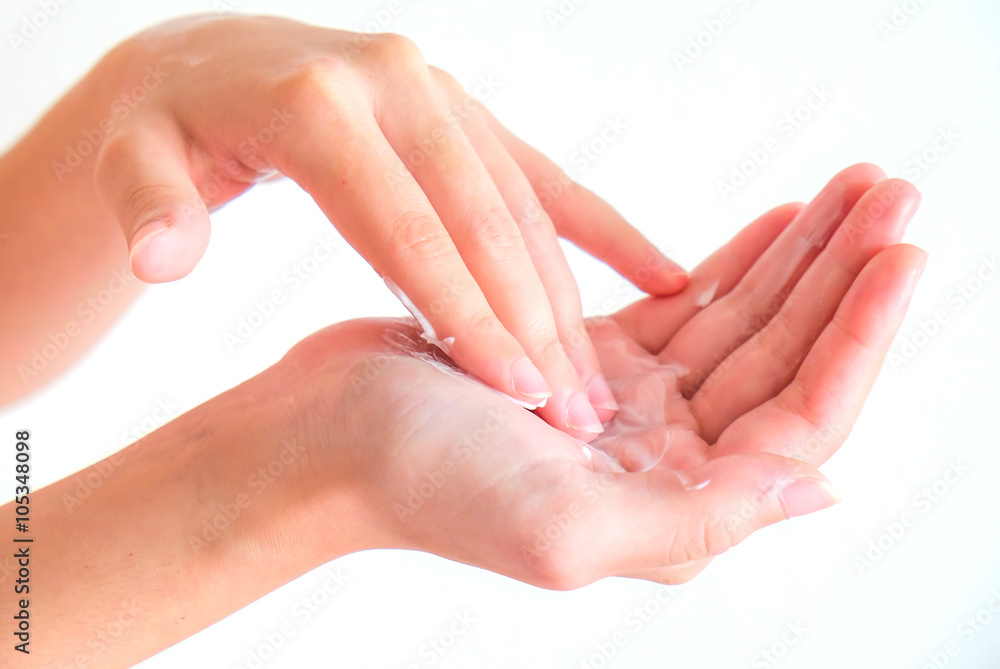 cream on woman hand with isolated background