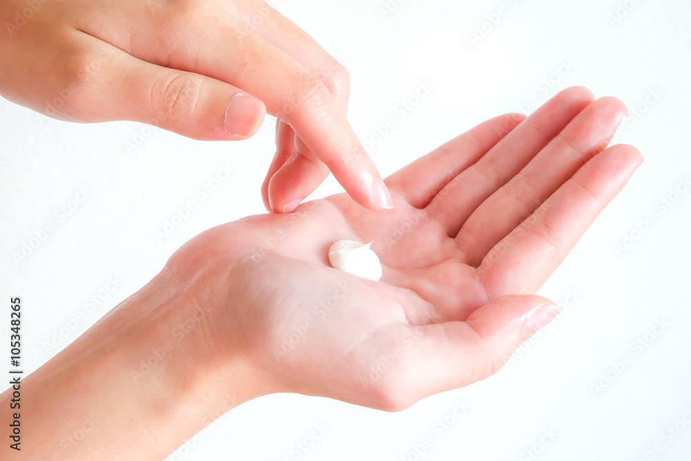 cream on woman hand with isolated background