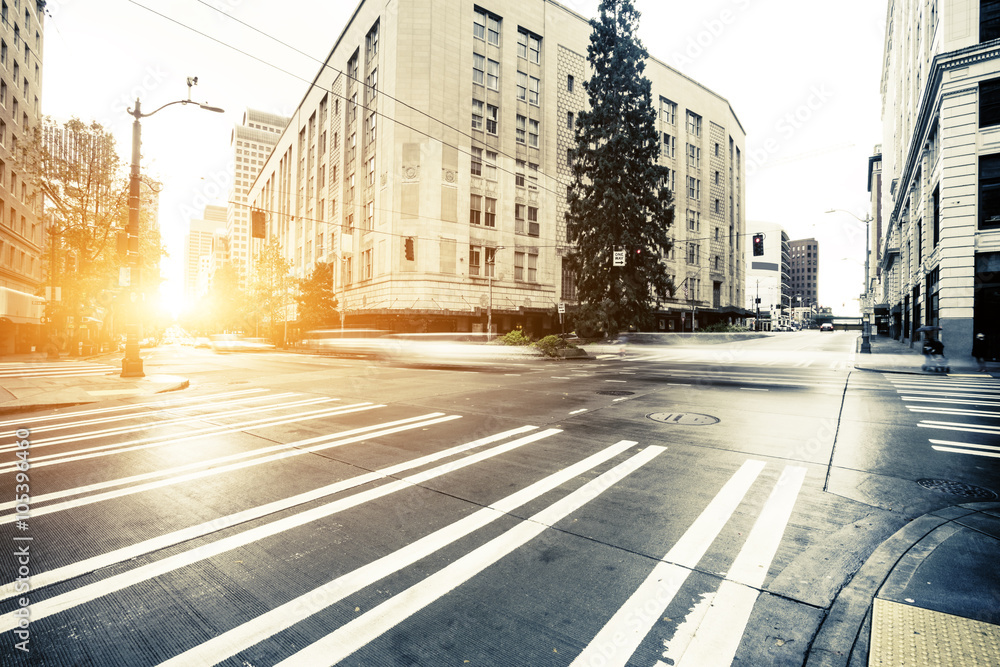 traffic on cityroad through modern buildings in seattle