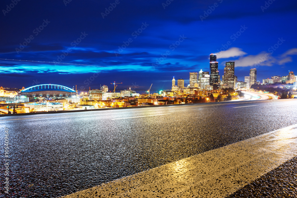 road with cityscape and skyline of seattle