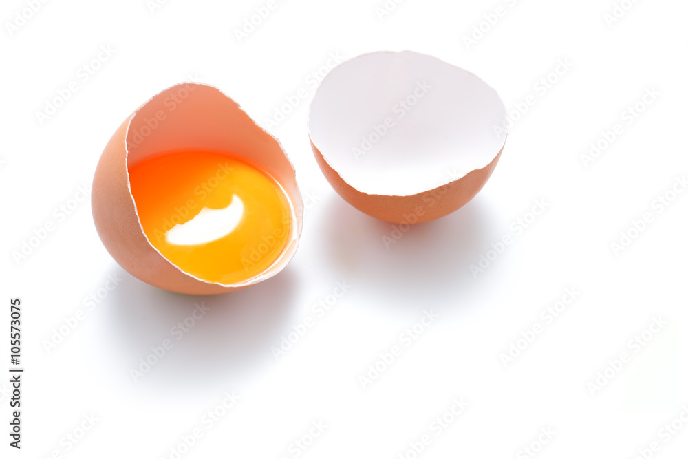 Close up of cracked egg isolated on white background