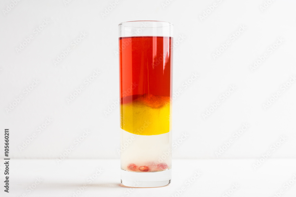 Layred cocktail on the wooden background