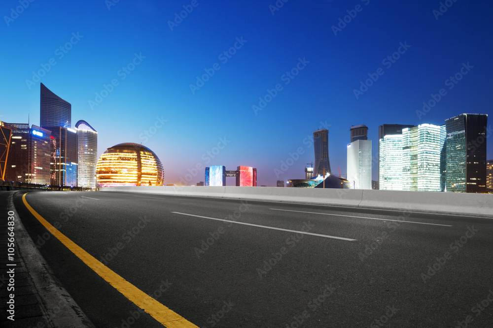 empty asphalt road with cityscape and skyline of hangzhou