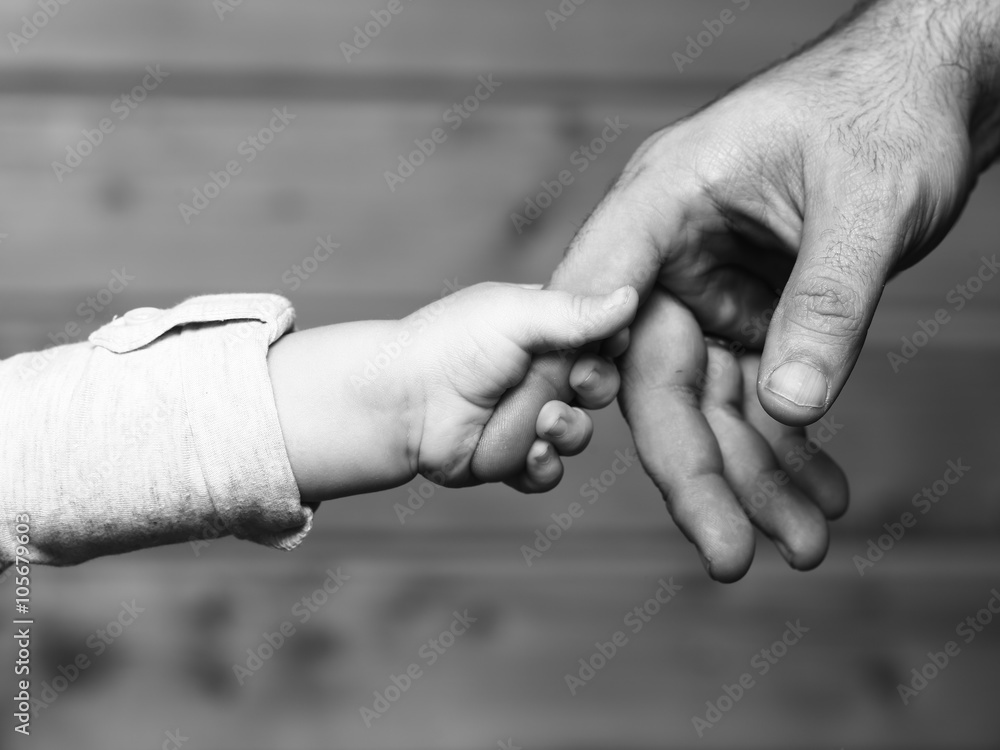 Hands of son and father