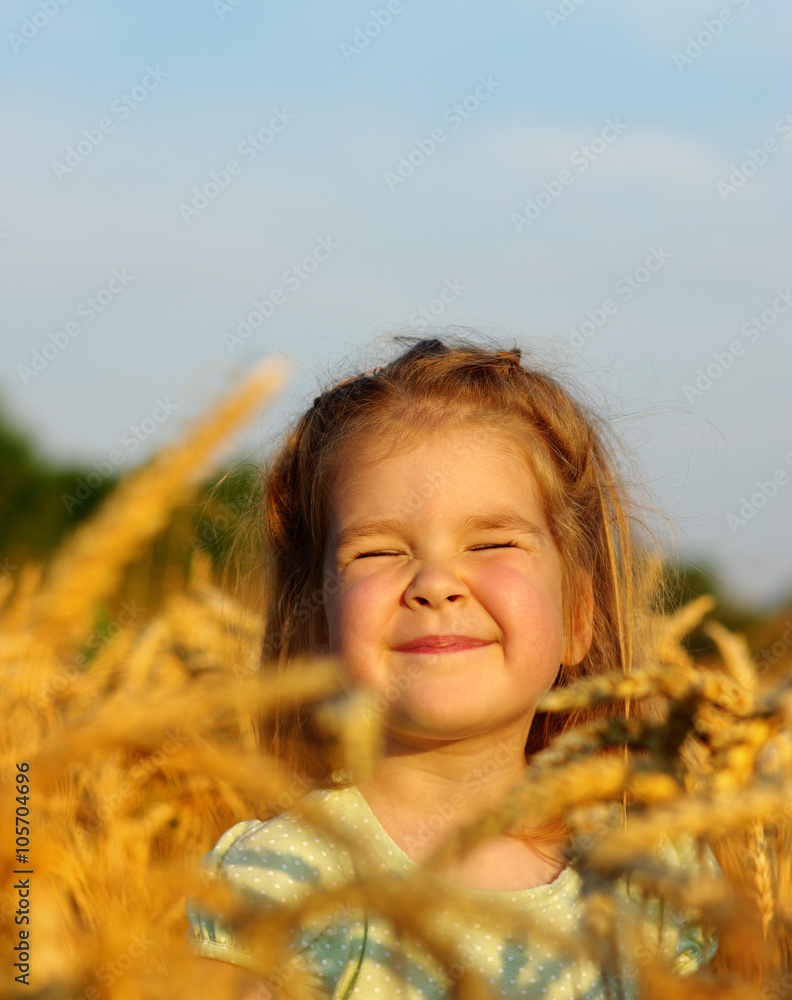 Girl on a wheat