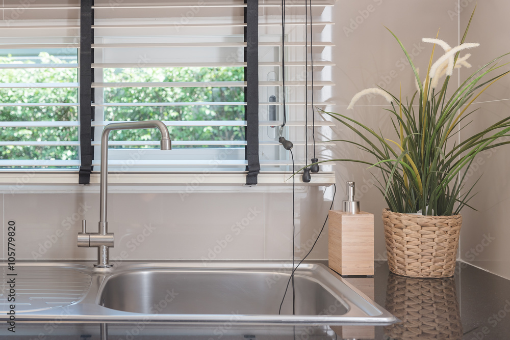 sink with faucet on black kitchen counter