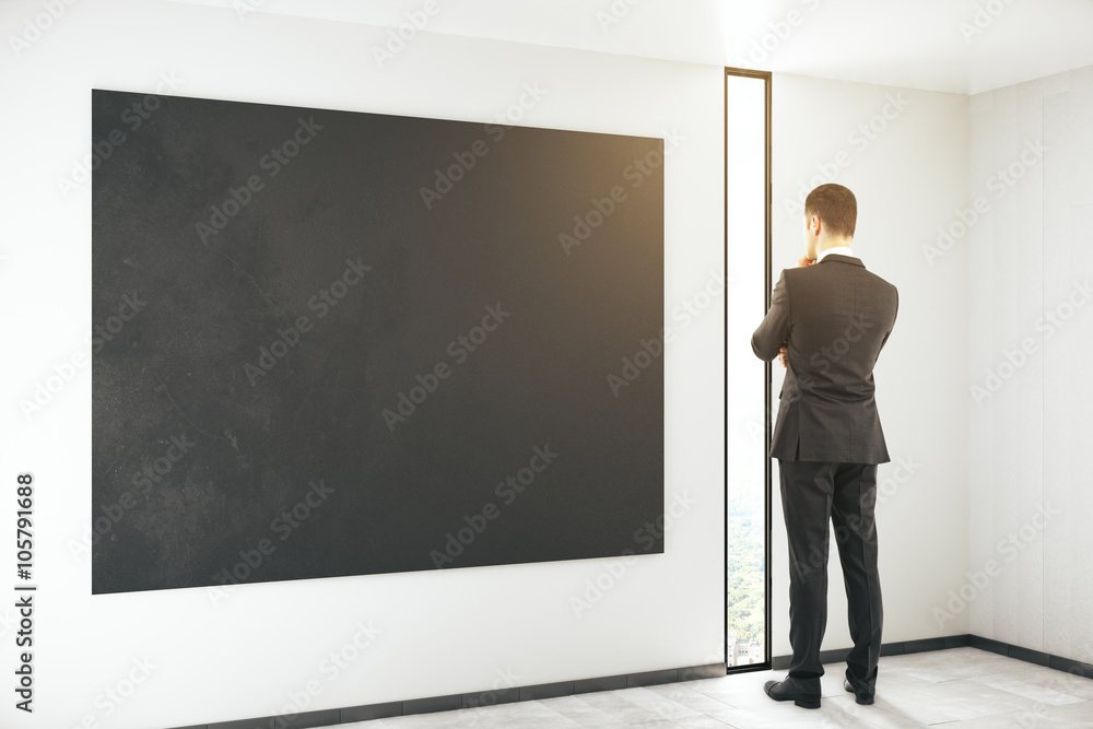 Blackboard and thinking man