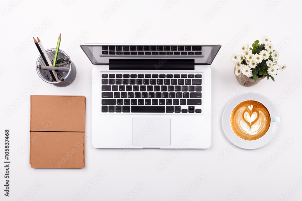 Top view laptop or notebook workspace office and latte coffee on