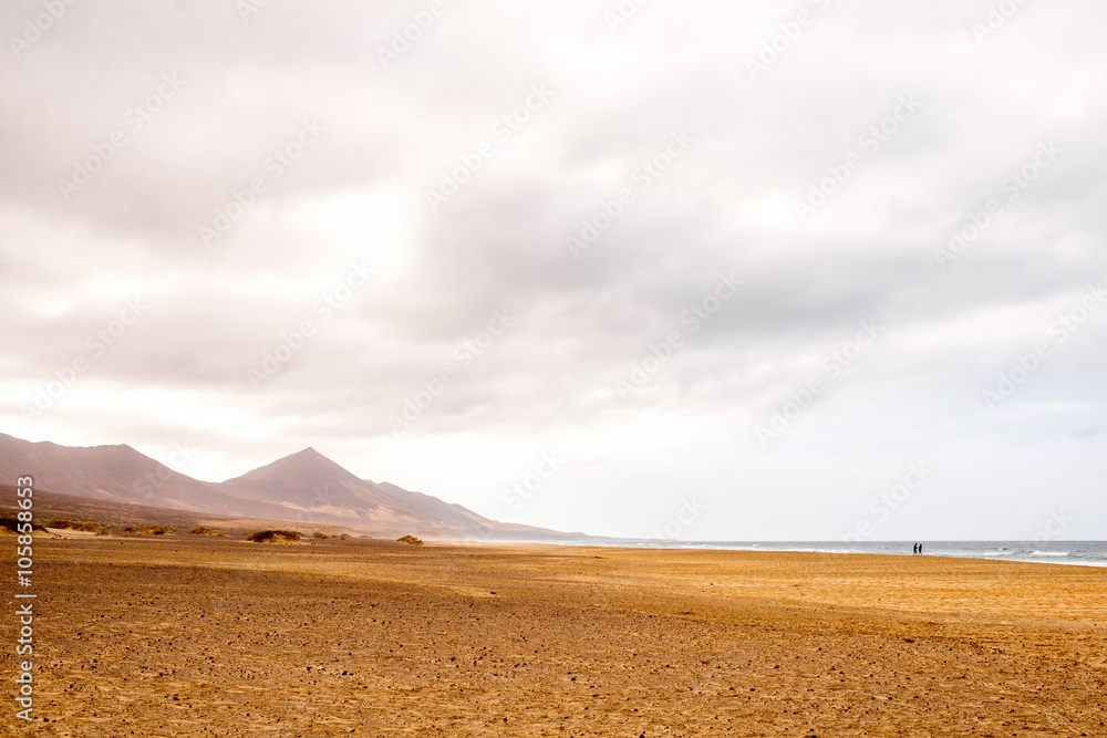 Cofete beach at the cloudy and foggy weather on Fuerteventura island in Spain