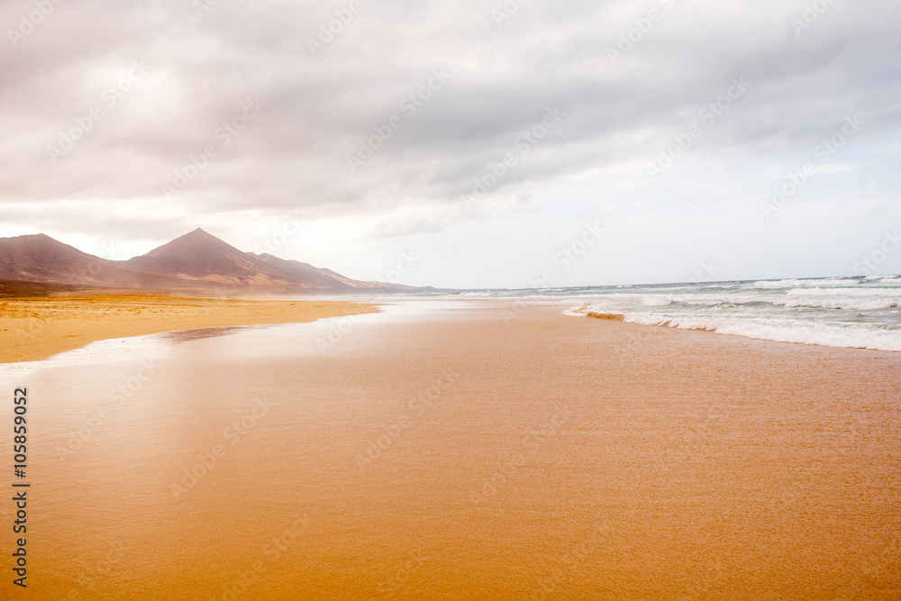 Cofete beach at the cloudy and foggy weather on Fuerteventura island in Spain