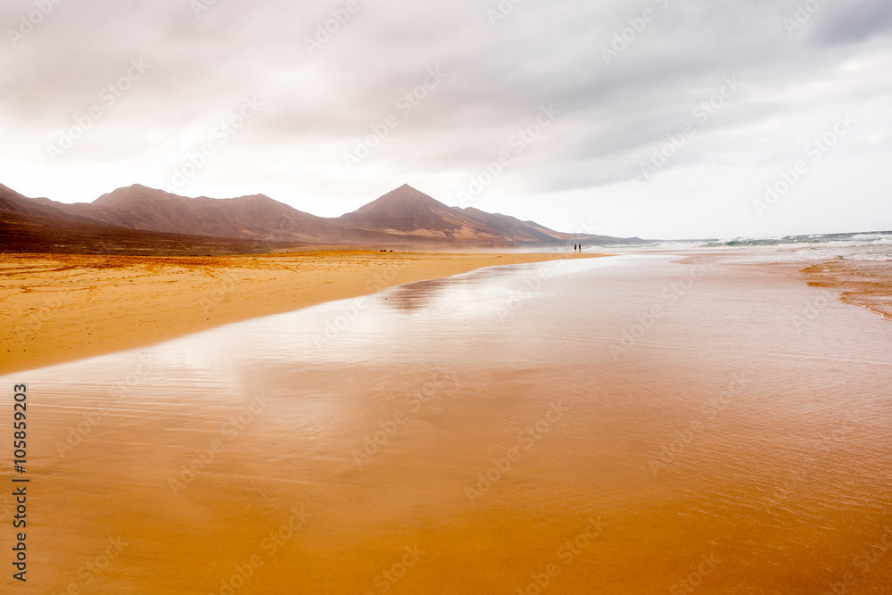 Cofete beach at the cloudy and foggy weather on Fuerteventura island in Spain