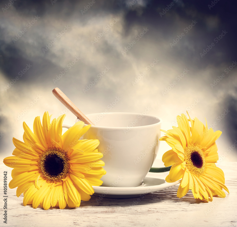 Coffee cup with yellow gerberas