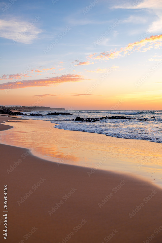 Beautiful sand beach near El Cotillo village on Fuerteventura island on the sunset in Spain