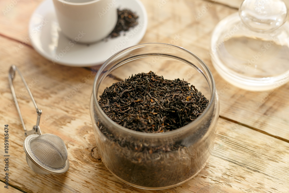 Tea set on the wooden table at sunny morning