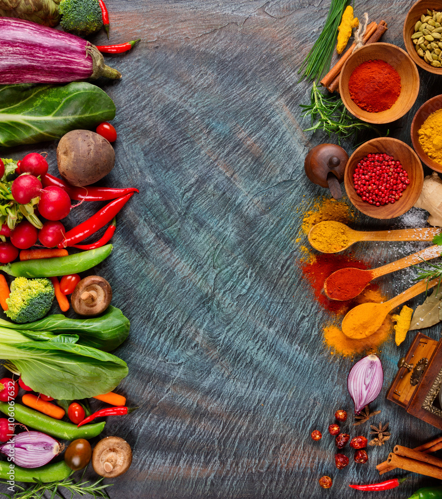 Various spices on black stone