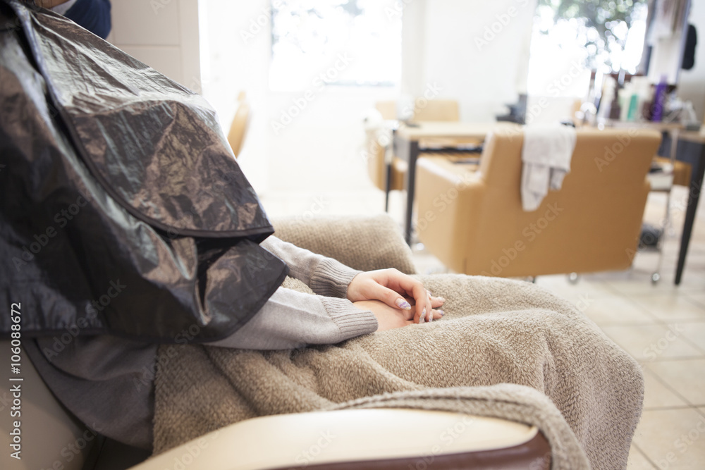 Woman sitting in a chair in the beauty salon