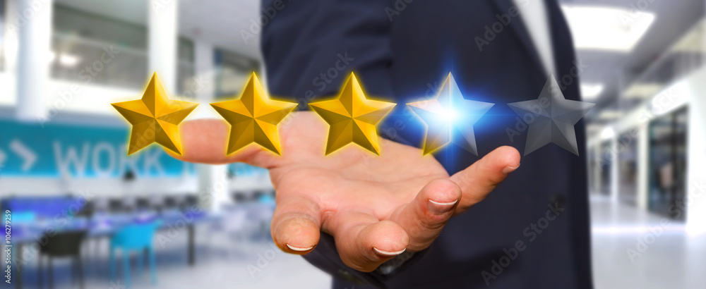 Businessman rating stars with his hand