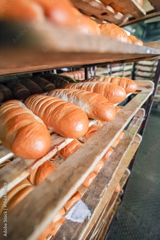 Fresh loaf on the shelf at bread factory