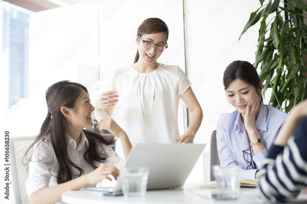 Women who are working in bright office