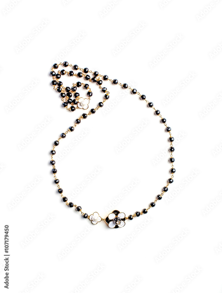 necklace with flower and black beads isolated