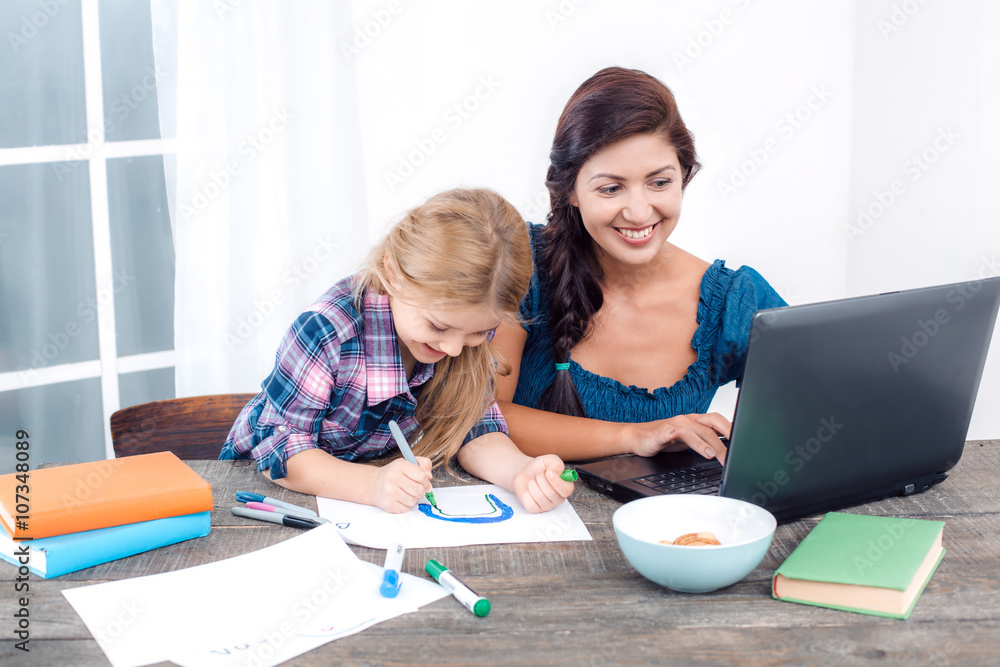 Happy mother and daughter at home